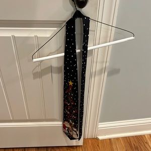 Tacky Christmas tie. Black with white polka dots and Christmas characters.